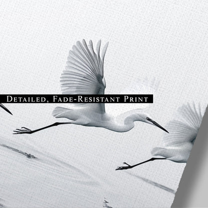 Tranquil wall art depicting elegant egrets flying over serene lake - Serene Flight