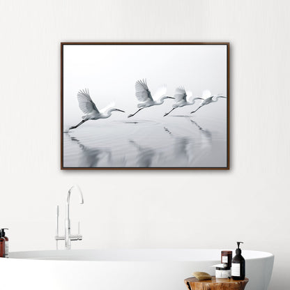 Tranquil wall art depicting elegant egrets flying over serene lake - Serene Flight